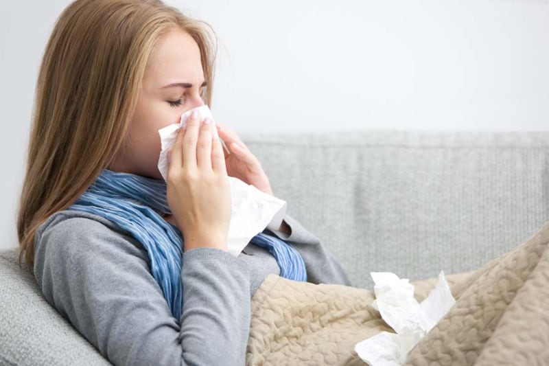 Woman Sneezing