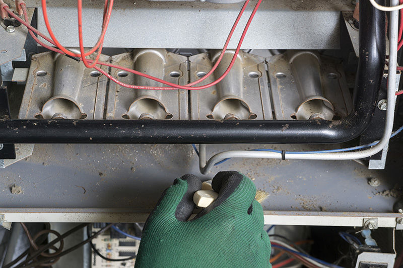 Man Cleaning Furnace