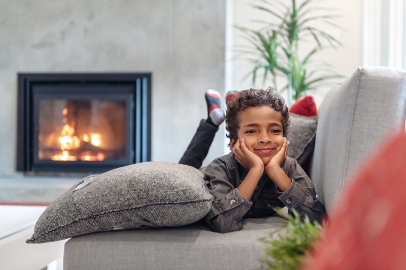 Gas Fireplaces - Staying Safe. Little boy excited and waiting for Thanksgiving.